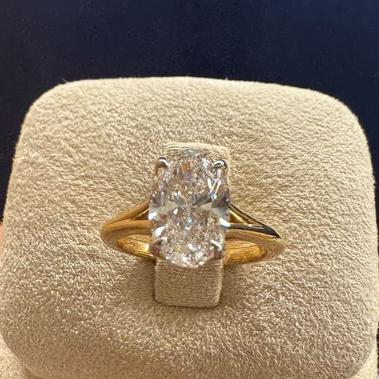 2 carat oval on a slight split gold band