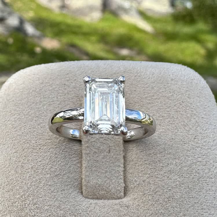 2 carat F VS2 emerald cut lab with a hidden halo