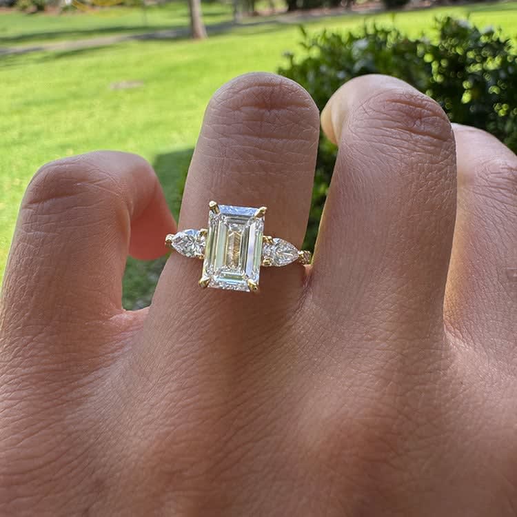 Emerald cut with pear sides ring