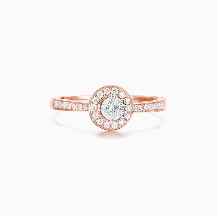 Round Brilliant cut diamond with a pave halo Engagement ring
