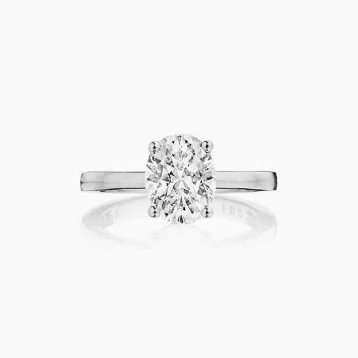 Oval Cut diamond engagement ring on a plain band