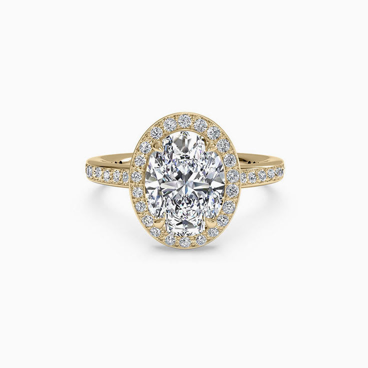 Oval Cut engagement ring with a daimond halo and diamond band