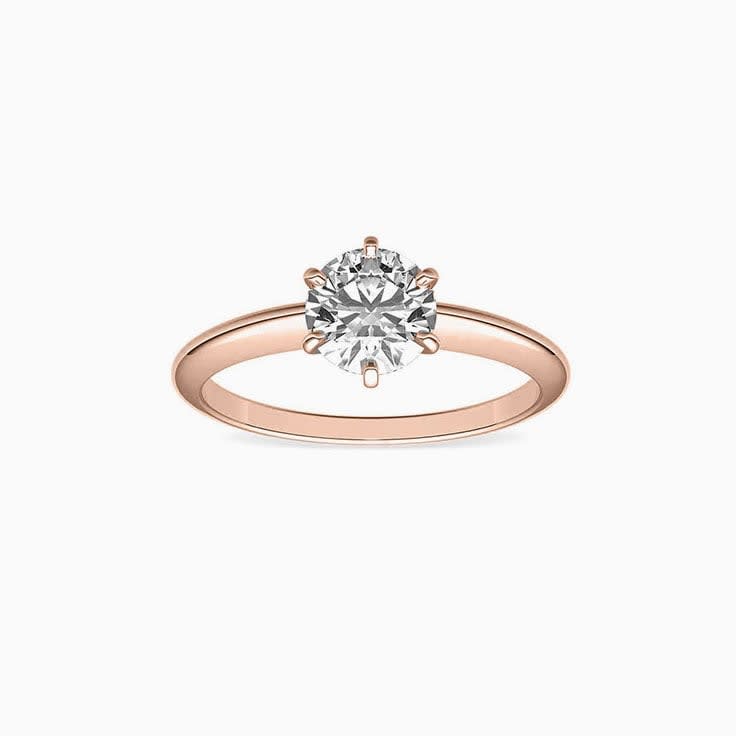 Knife edge engagement ring with round brilliant diamond