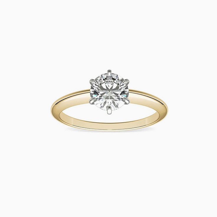 Knife edge engagement ring with round brilliant diamond