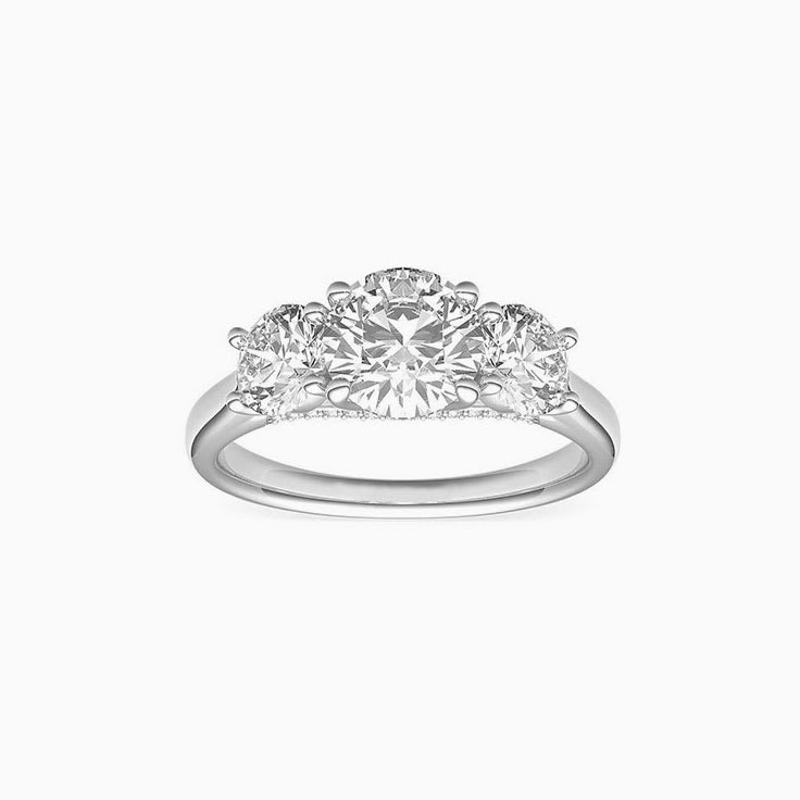 Round brilliant cut diamonds in a trilogy setting engagemnt ring
