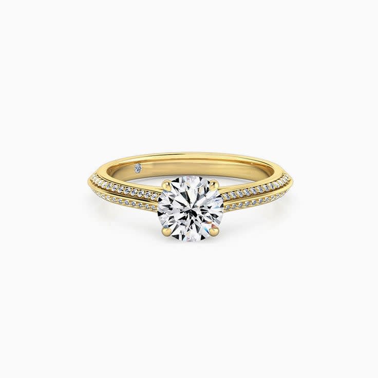 Round Brilliant Cut enagagement ring On A Knife Edge diamond band