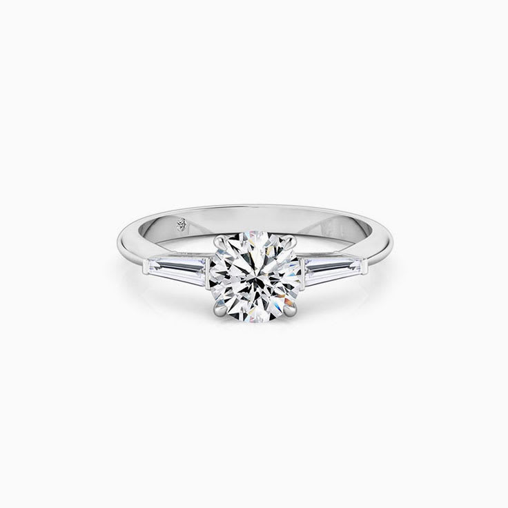 Round diamond with tapered bagguette Engagement ring