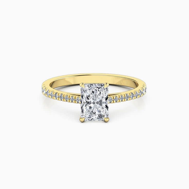 Radiant cut diamond engagement ring on a diamond band