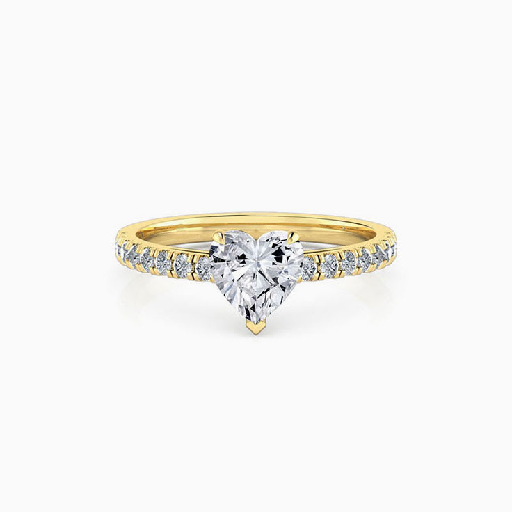 Heart shape diamond engagement ring on a diamond band