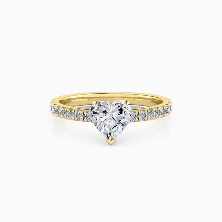 Heart shape diamond engagement ring on a diamond band