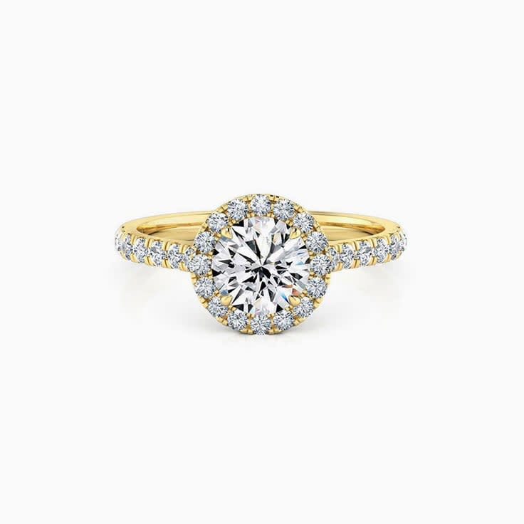 Round halo on cathedral setting engagement ring