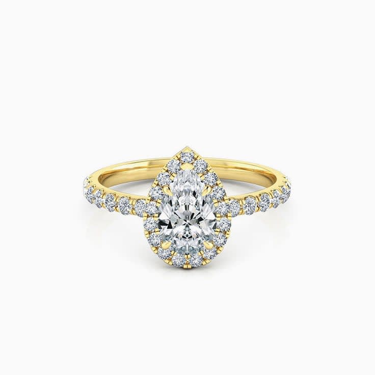 Pear cut diamond engagement ring with halo