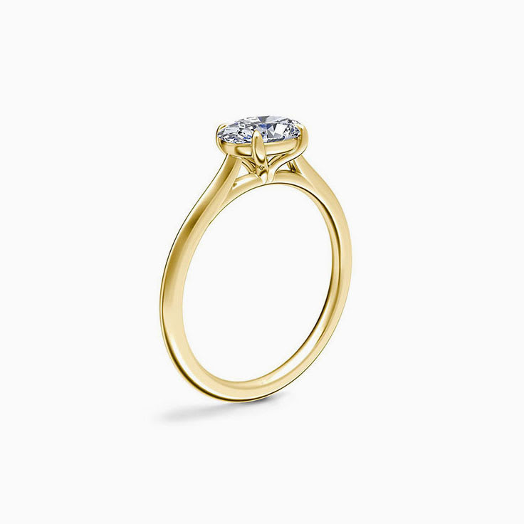 East to west emerald engagement ring