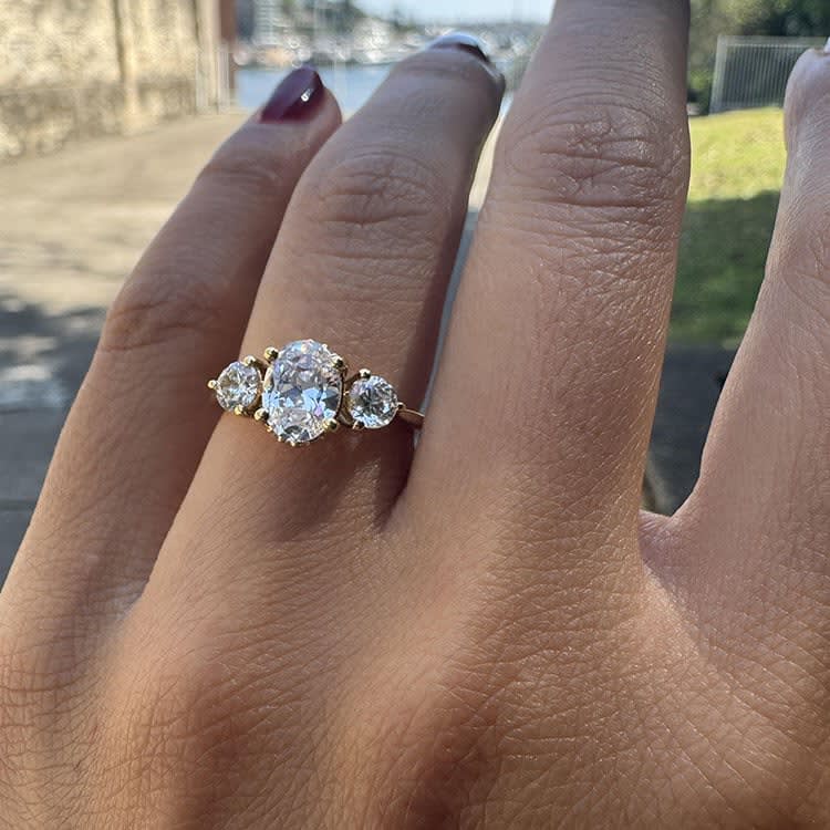 Oval trilogy engagement ring