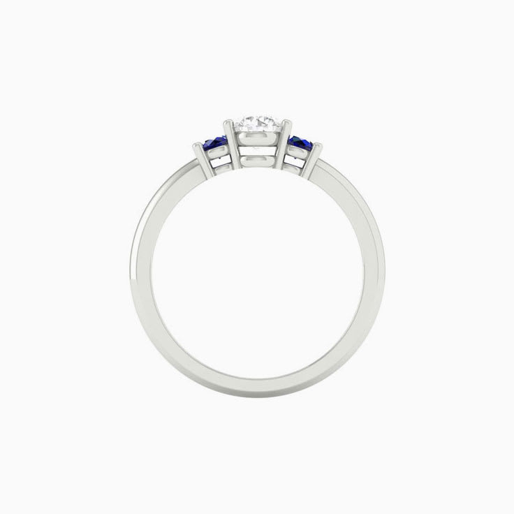 White diamond with blue sapphire trilogy
