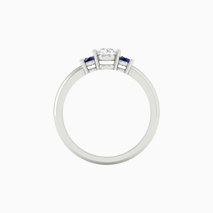 White diamond with blue sapphire trilogy
