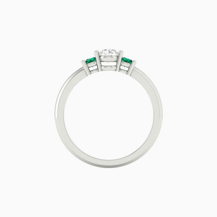 White diamond with green emerald trilogy