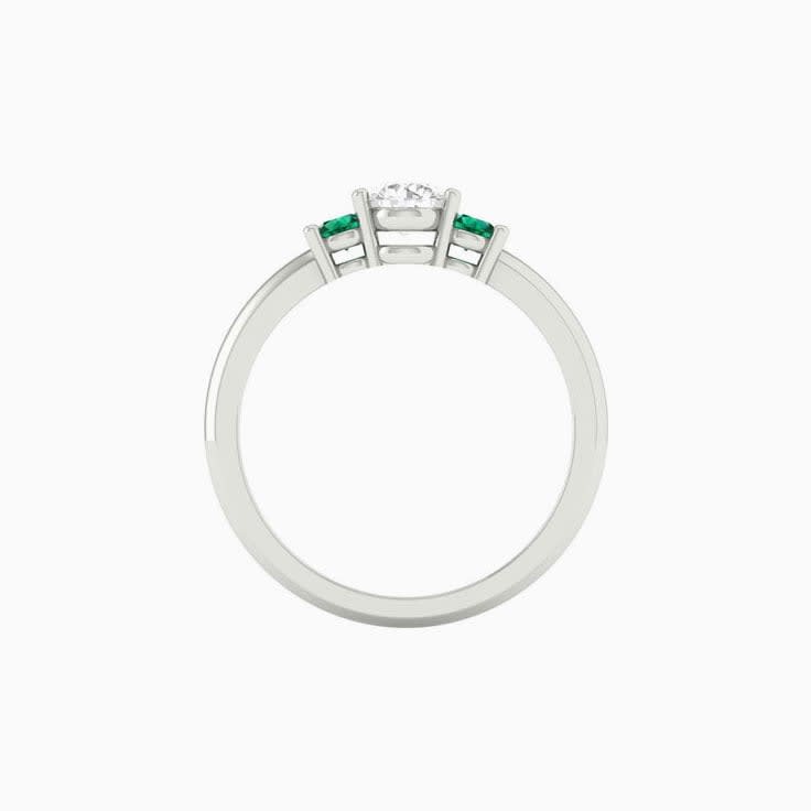 White diamond with green emerald trilogy