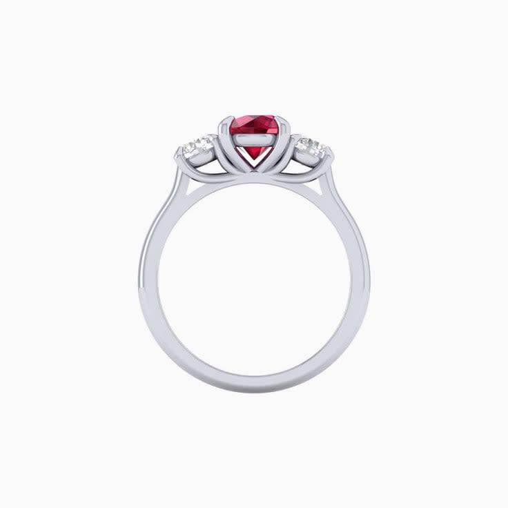 Round ruby with diamond trilogy ring