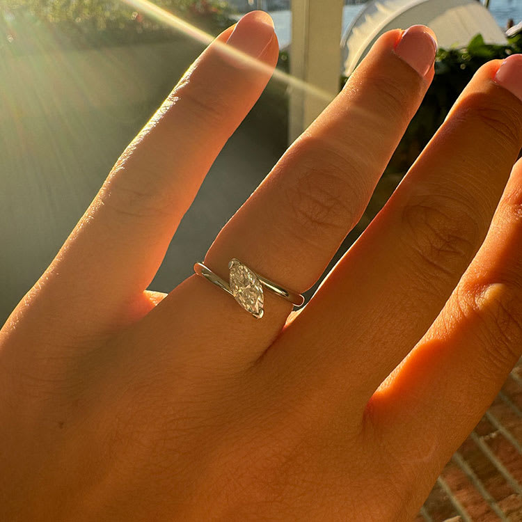 Unique solitaire marquise engagement ring