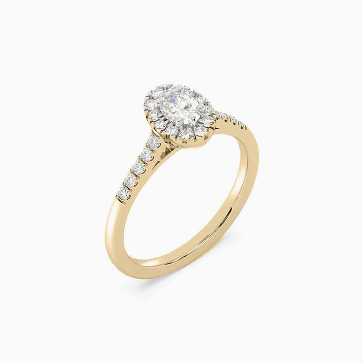 Petite oval halo diamond ring