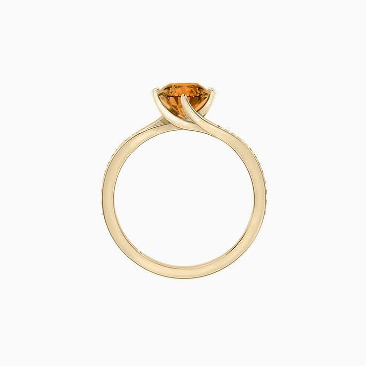 Round Brilliant cut Orange Sapphire on a twisted diamond band