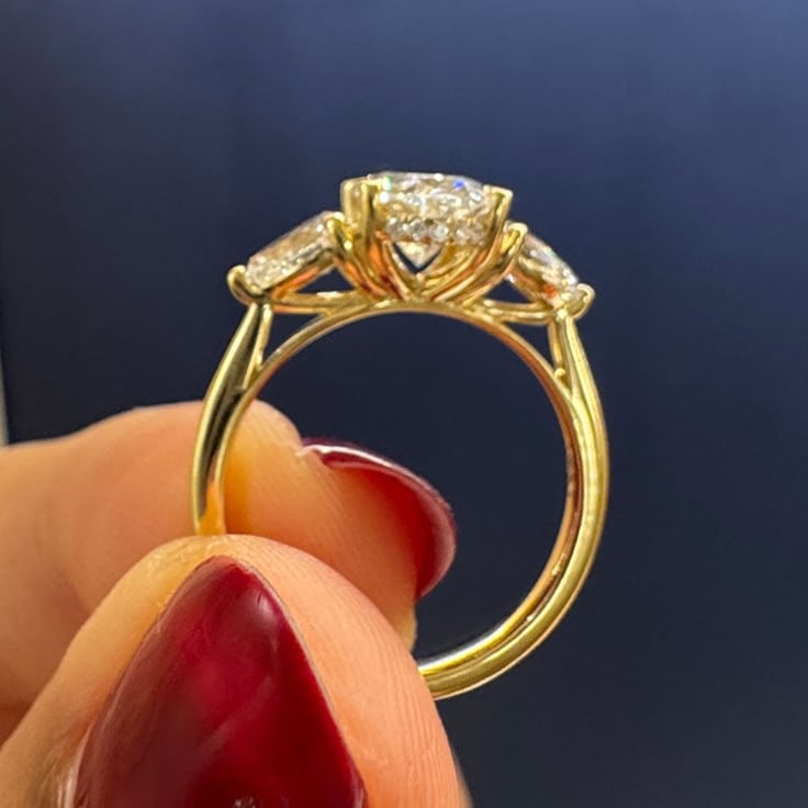 2 carat oval in a trilogy setting