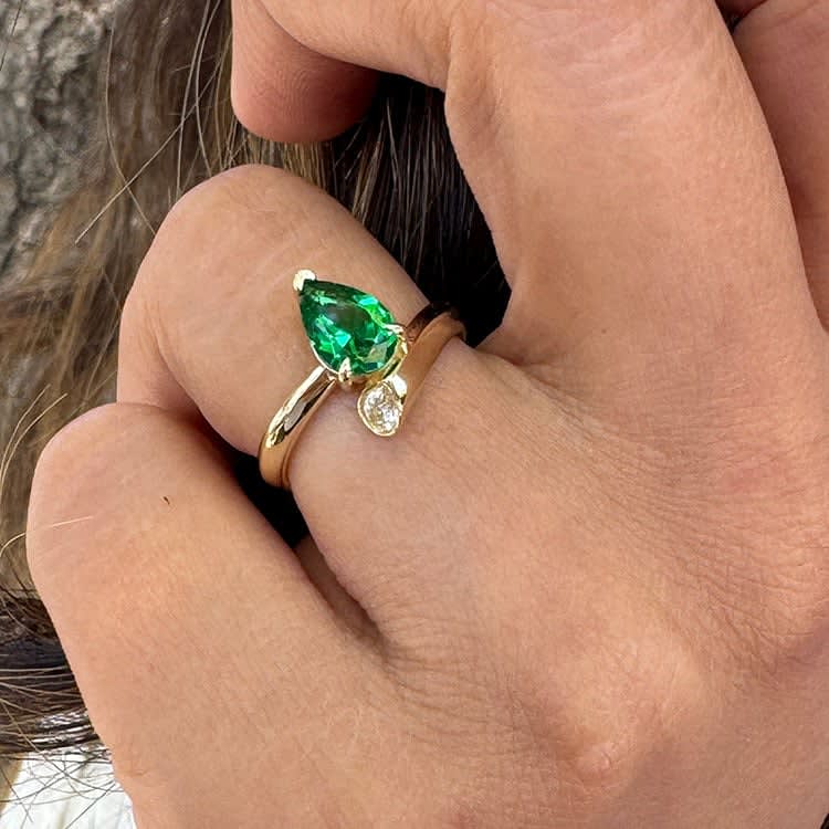 Green emerald in a unique setting
