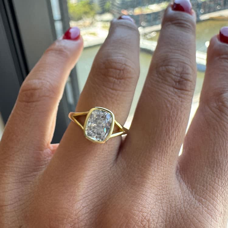 Bezel set cushion cut diamond