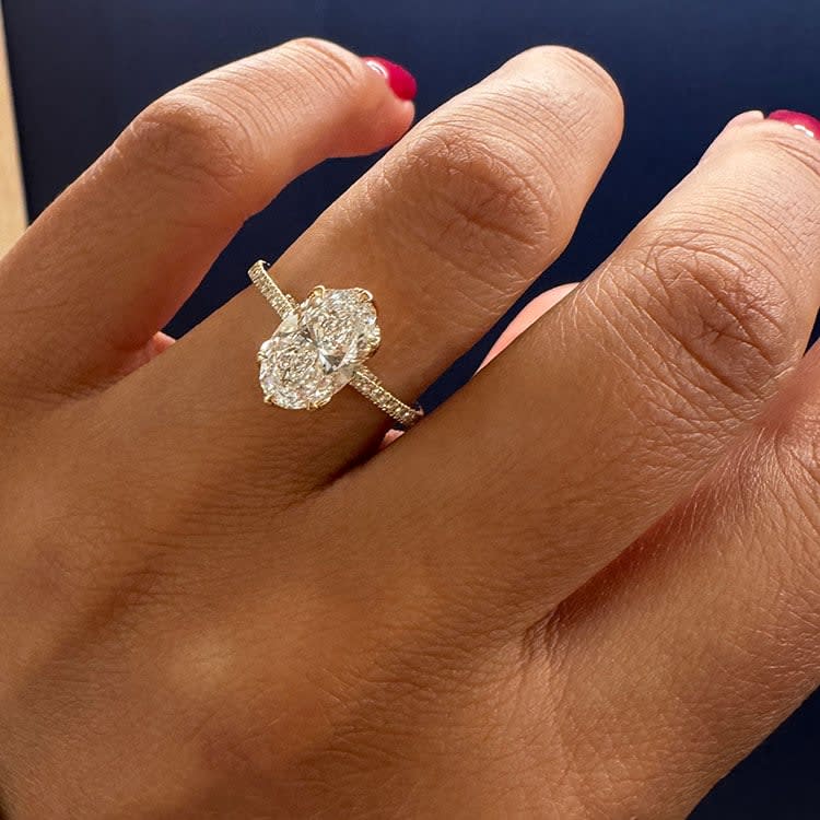 Oval cut diamond in tulip setting