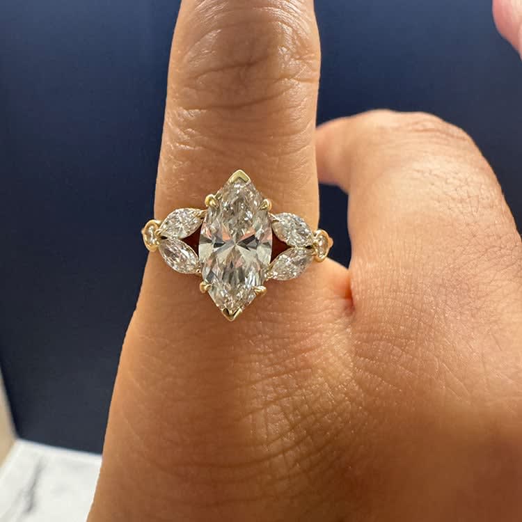 Marquise diamond with side marquise engagement ring