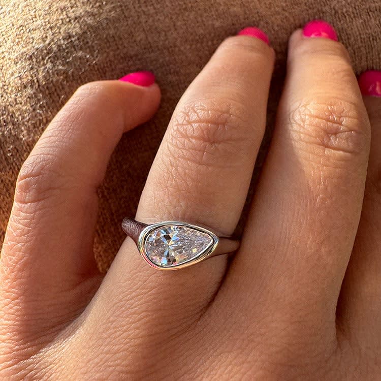 Pear diamond Bezel set on a solid band
