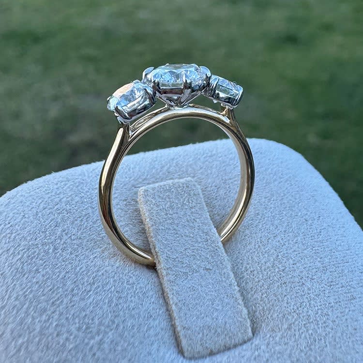 Round diamond trilogy ring on gold band
