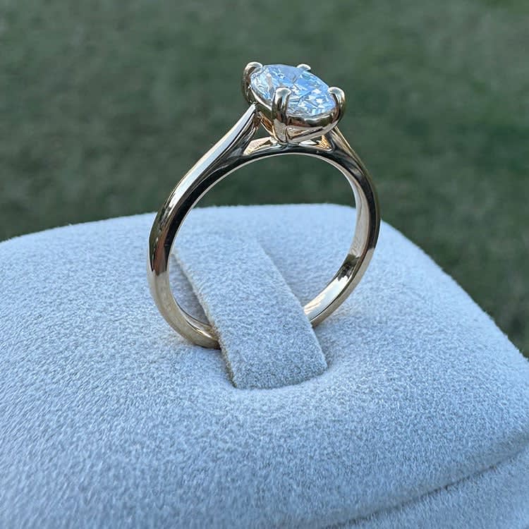 1ct oval solitaire on a gold band