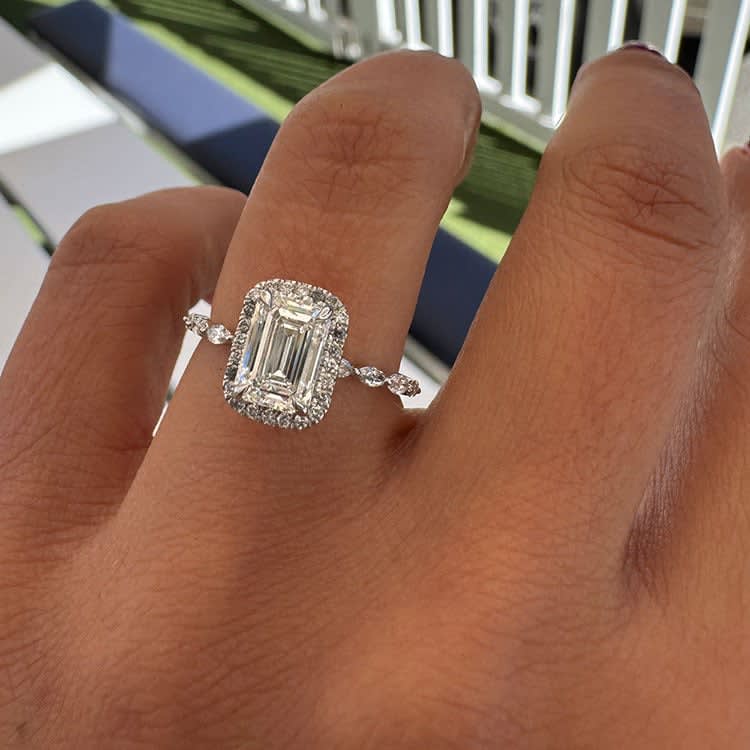 Emerald with halo and marquise band
