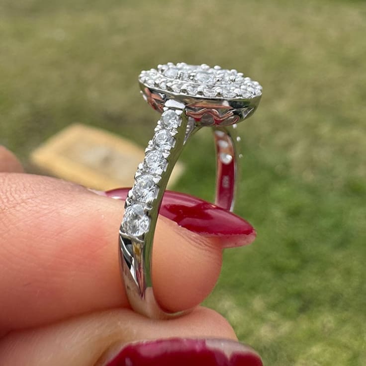 Oval cluster with halo and diamond band