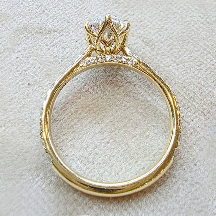 oval diamond set with tiger prongs and tulip setting