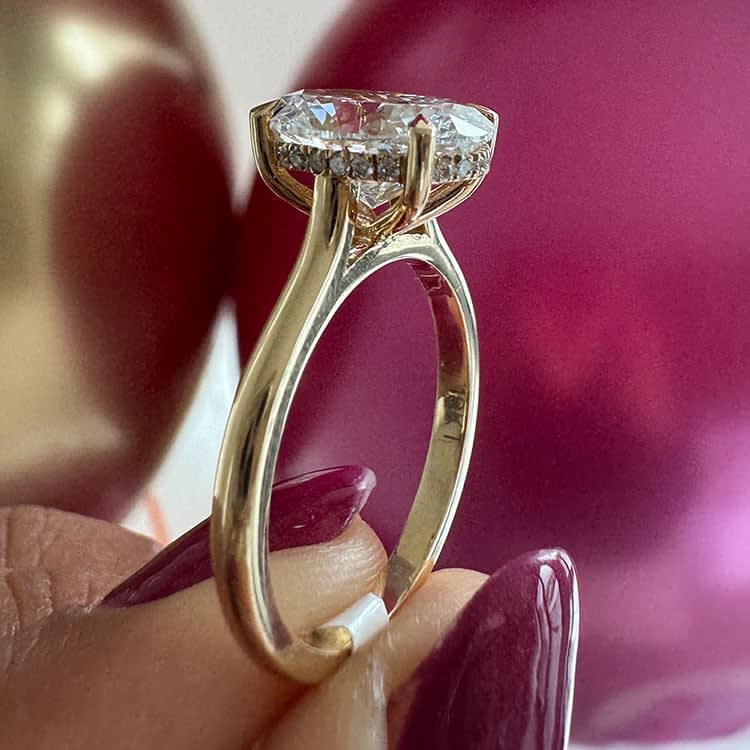 3ct oval on a classic band with hidden halo
