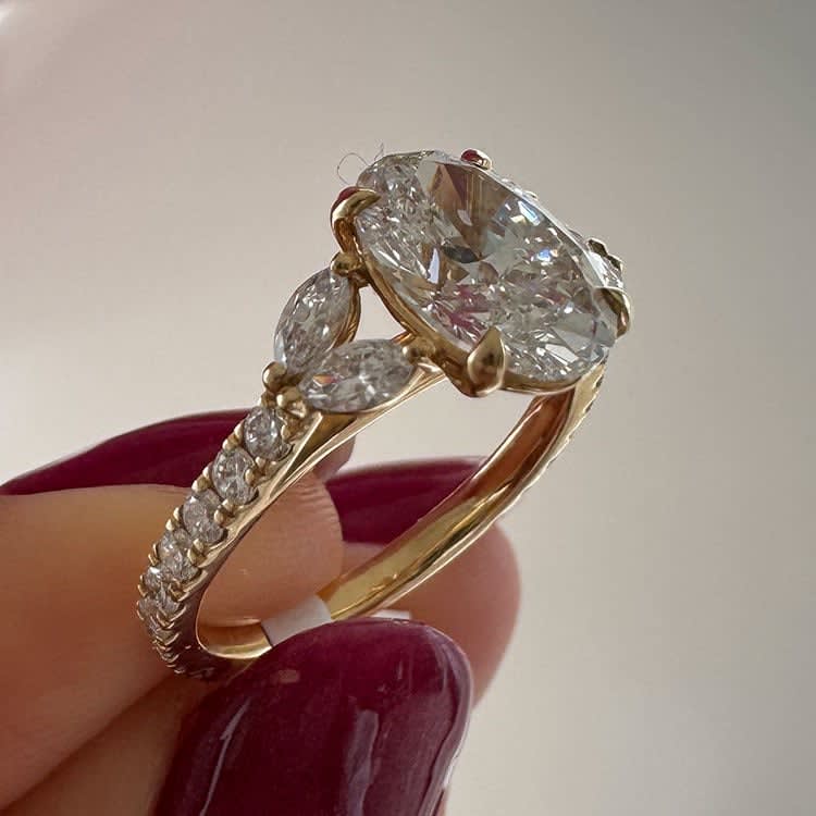 2 carat oval with marquise on the side