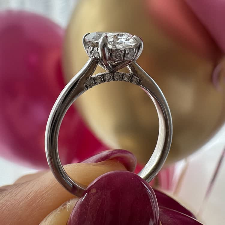 Classic 2 carat oval with a hidden halo