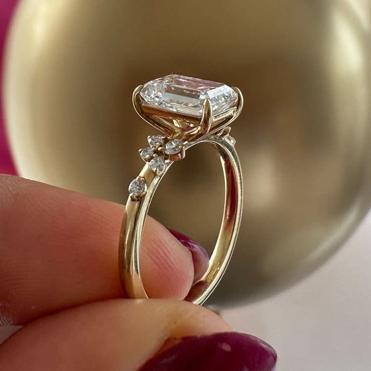 3 carat emerald with diamond band