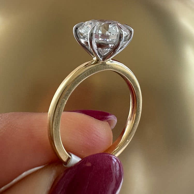 3 carat round brilliant diamond on two tone setting
