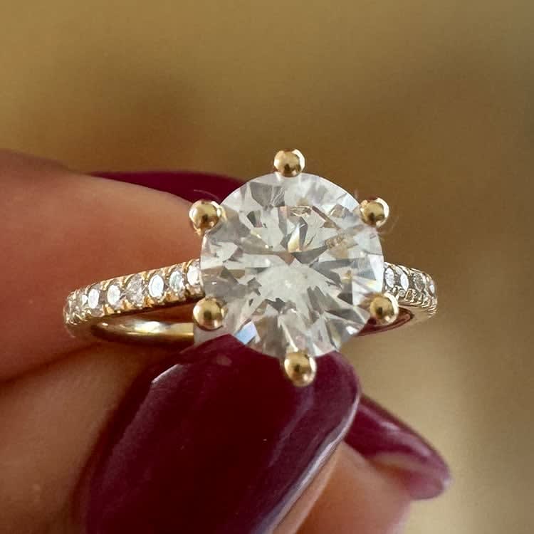 Classic round diamond with cathedral setting