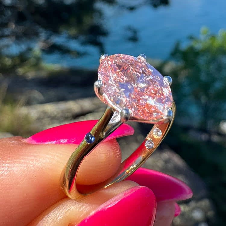 Fancy vivid pink oval diamond engament ring