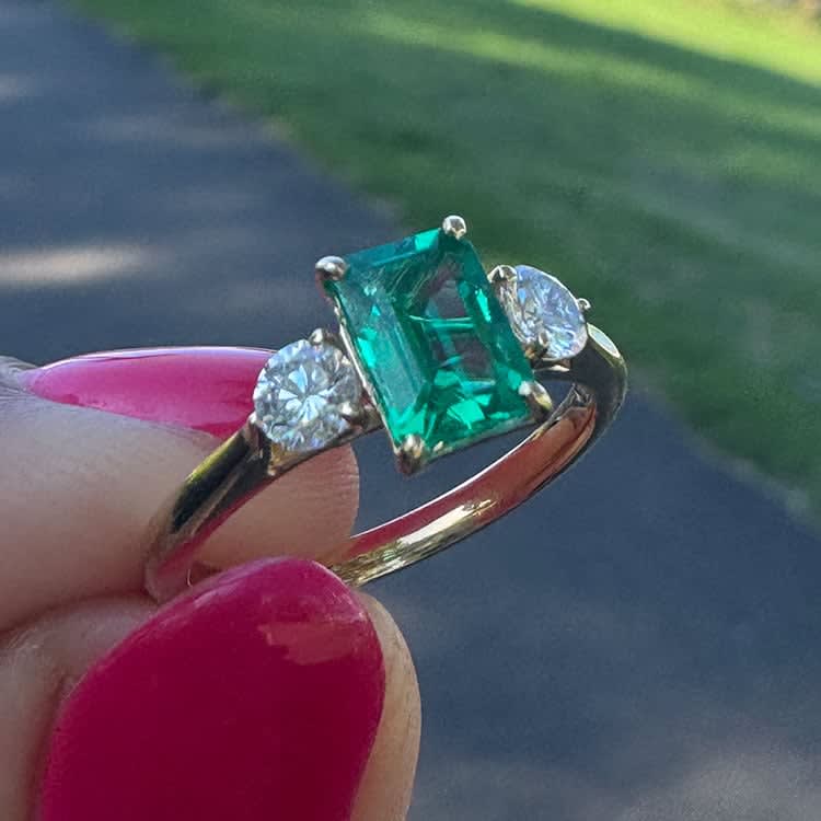 Lab green emerald with white diamonds