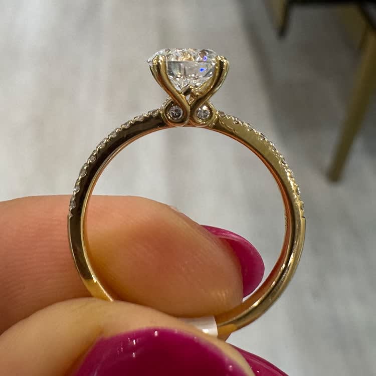 Round diamond on a diamond band yellow gold