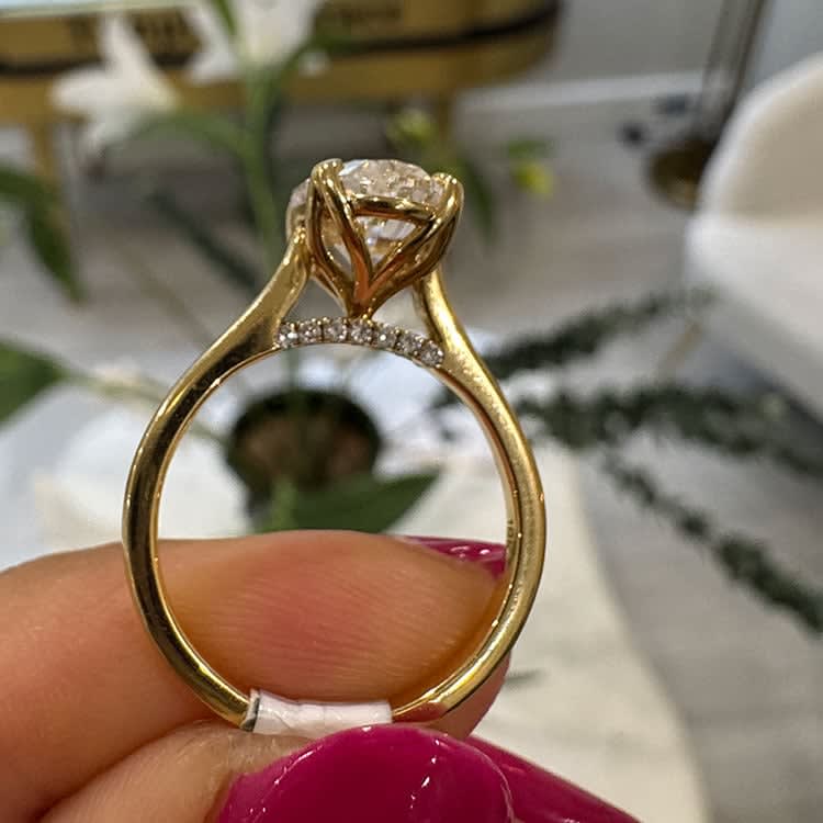 Oval diamond with a tulip setting
