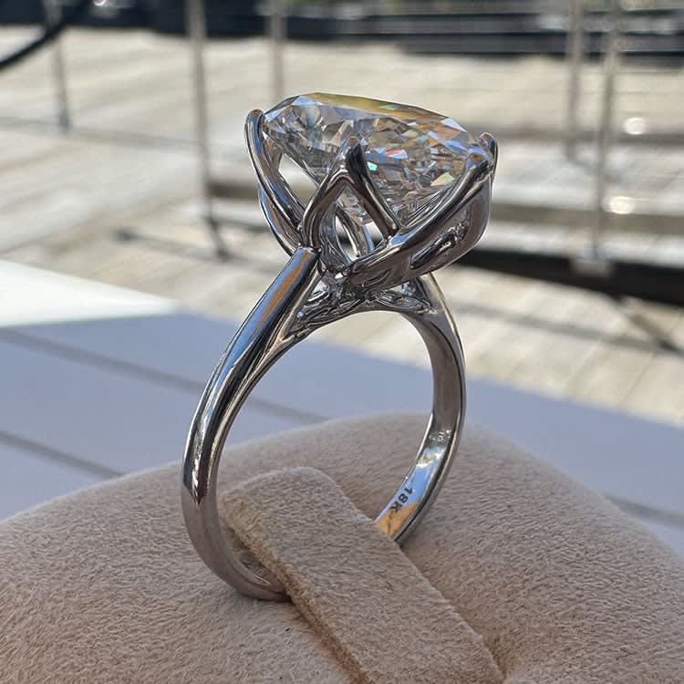 6 carat oval set in tulip setting