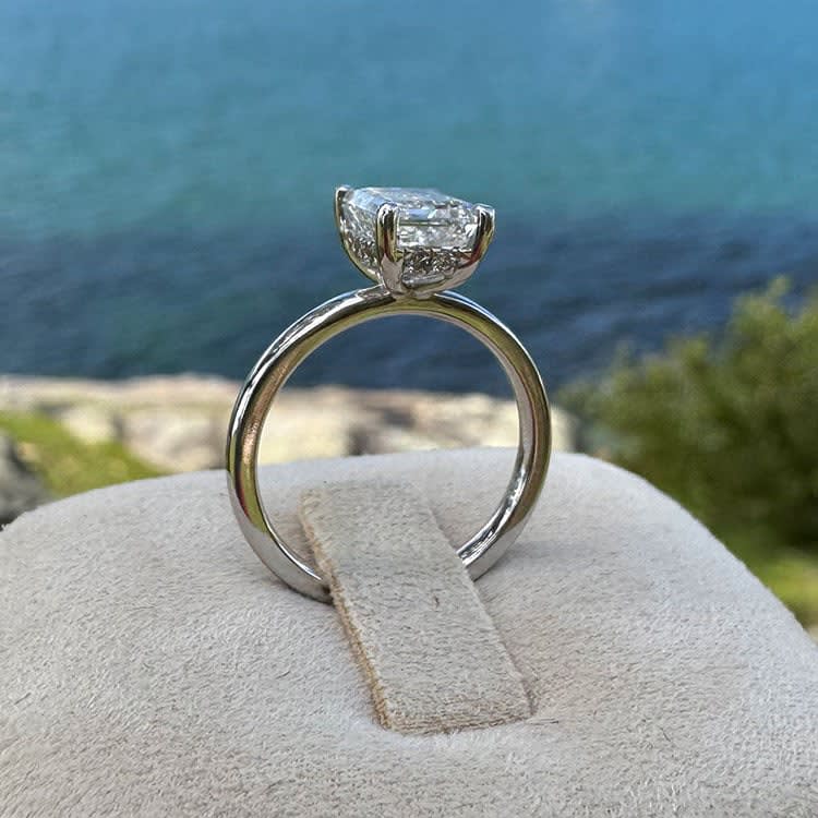 2 carat F VS2 emerald cut lab with a hidden halo