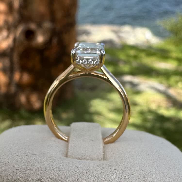 18k yellow gold ring set with lab emerald cut white diamond
